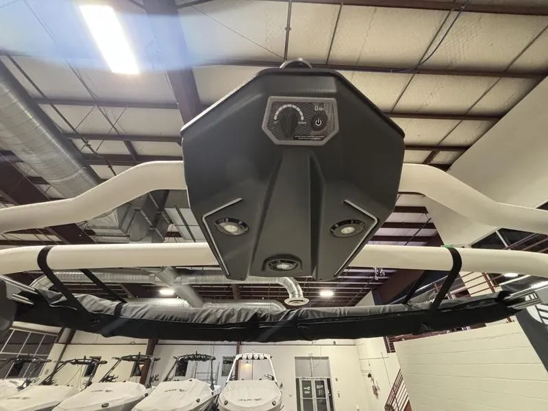 Slide: The Image of 2025 Malibu 23 LSV boat interior with advanced control panel and speakers. - 18