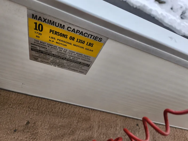 Slide: The Image of Capacity label on Sweetwater 180 boat, 2000 model, showing limits for persons and weight. - 18