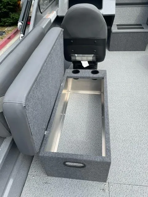Slide: The Image of 2025 Spartan 200 Astoria boat interior with storage compartment and seating. - 6