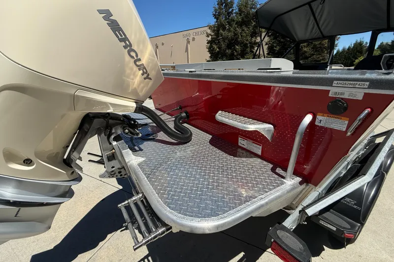Slide: The Image of 2025 Spartan 200 Astoria boat with Mercury outboard motor, featuring a red aluminum deck. - 15