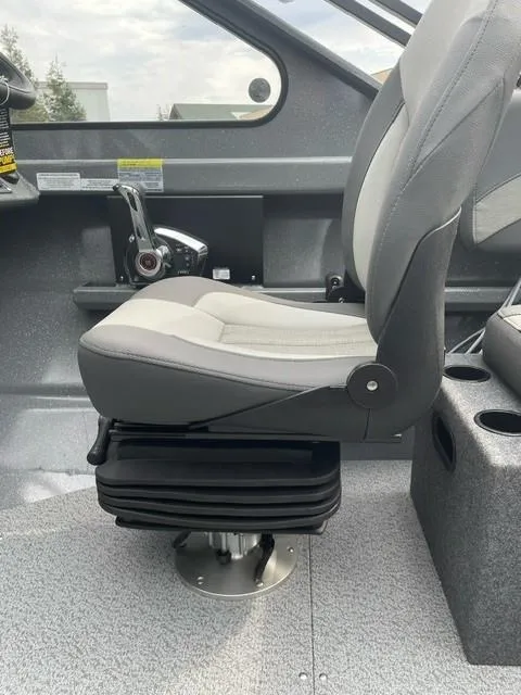 Slide: The Image of 2025 Spartan 200 Astoria boat interior with a modern captain's seat and control panel. - 7