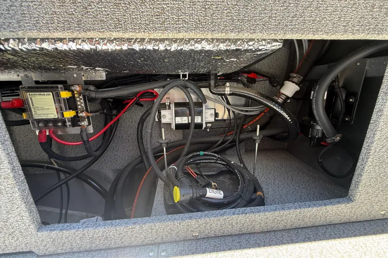 Slide: The Image of Electrical compartment of 2025 Spartan 200 Astoria, showcasing wiring and components. - 20