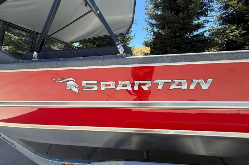 Slide: The Image of Red Spartan 200 Astoria boat, 2025 model, with bold logo and sleek design. - 12