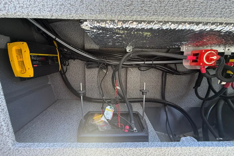 Slide: The Image of Electrical compartment of 2025 Spartan 200 Astoria with wiring and ProSportHD12 charger. - 24