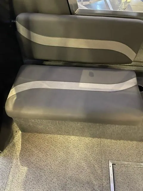 Slide: The Image of 2023 Spartan 215 Athens interior seat with modern design and gray upholstery. - 12