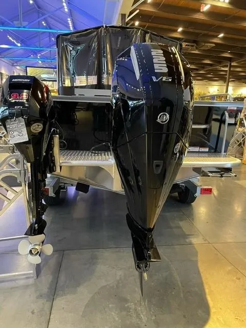 Slide: The Image of 2023 Spartan 215 Athens boat with powerful V6 outboard motor in showroom. - 16