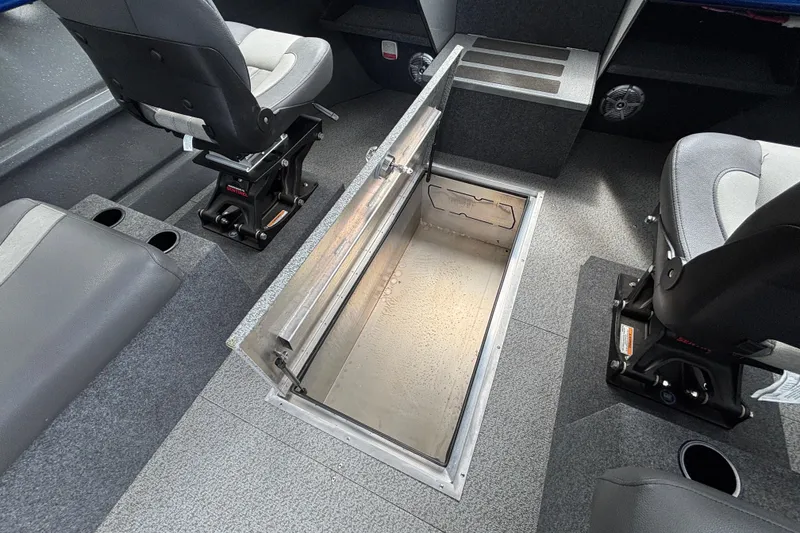 Slide: The Image of Interior of 2025 Spartan 240 Maximus Pro boat with open storage compartment. - 28