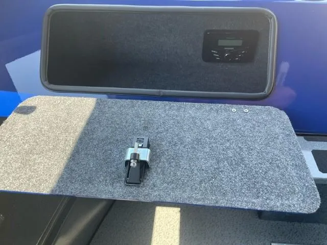 Slide: The Image of Storage compartment in a 2025 Spartan 240 Maximus Pro with electronic control panel. - 12