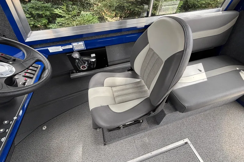 Slide: The Image of Interior of 2025 Spartan 240 Maximus Pro, featuring modern seating and control panel. - 17