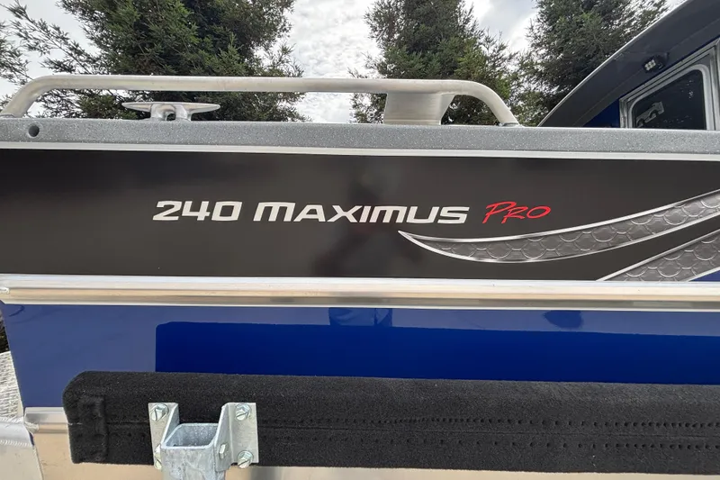 Slide: The Image of 2025 Spartan 240 Maximus Pro boat detail with sleek design and branding. - 40