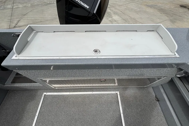 Slide: The Image of Interior view of 2025 Spartan 240 Maximus Pro boat, featuring storage compartments. - 36