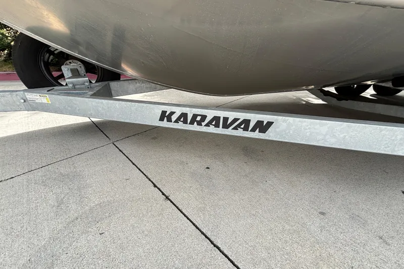 Slide: The Image of Trailer with "Karavan" branding supporting a Spartan 240 Maximus Pro, 2025 model. - 33