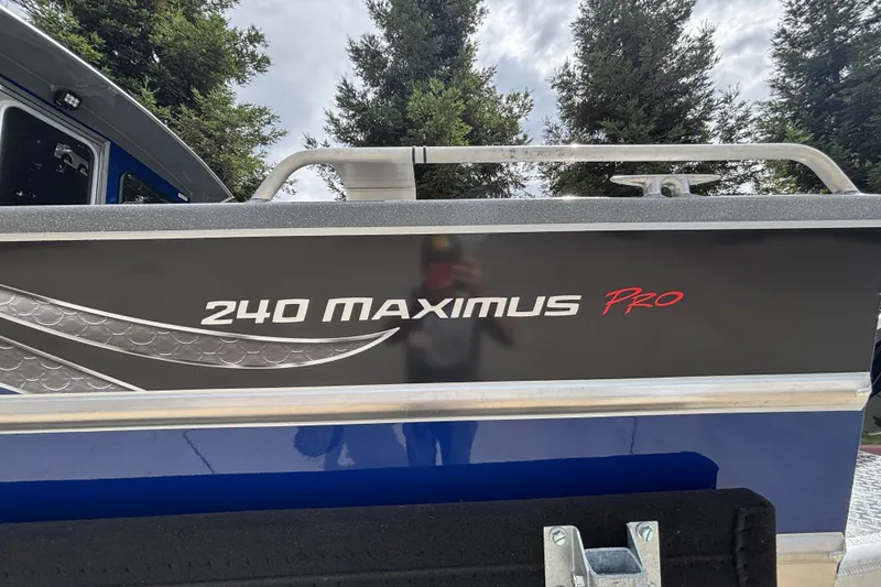 Slide: The Image of 2025 Spartan 240 Maximus Pro boat exterior with sleek design and branding. - 39