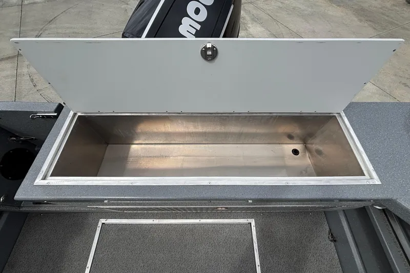 Slide: The Image of Open storage compartment on 2025 Spartan 240 Maximus Pro boat, showcasing spacious interior. - 41