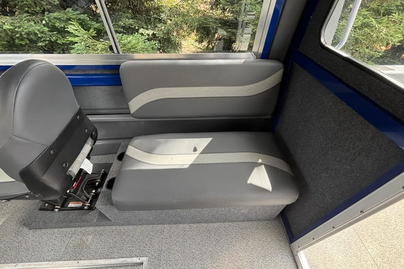 Slide: The Image of Interior seating of 2025 Spartan 240 Maximus Pro boat, featuring gray upholstery and modern design. - 15