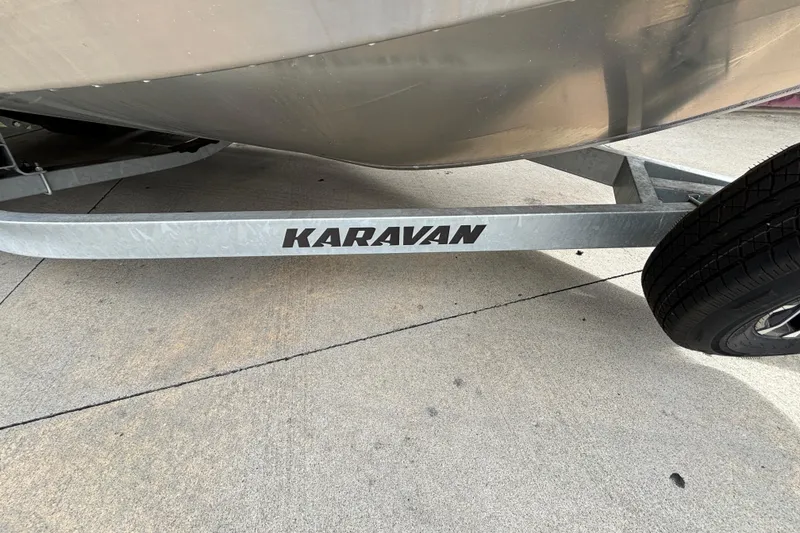 Slide: The Image of Trailer with "Karavan" branding, supporting a Spartan 240 Maximus Pro, 2025 model. - 31