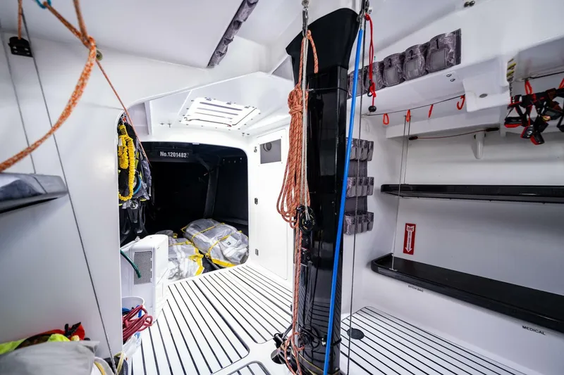 Slide: The Image of Interior of a 2007 McConaghy Reichel/Pugh yacht, featuring ropes, storage shelves, and nautical equipment. - 10