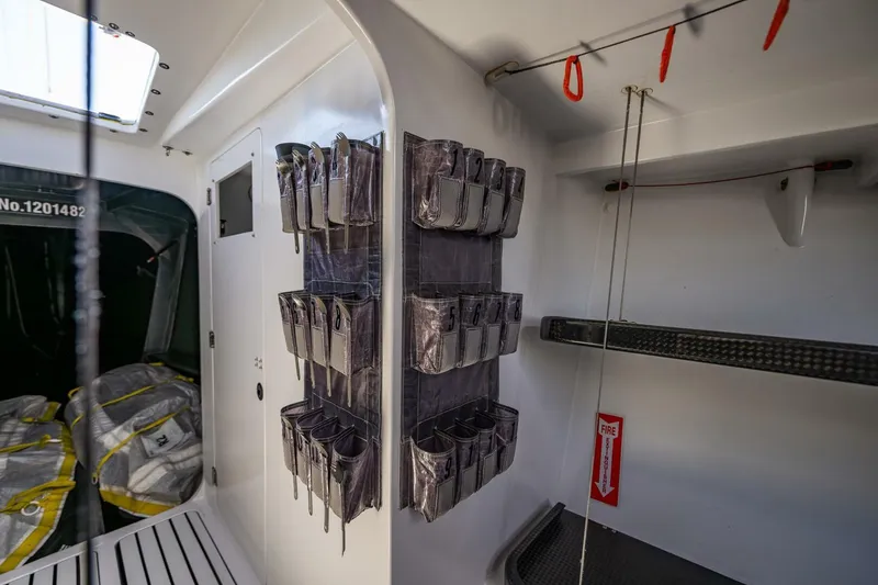Slide: The Image of Interior of 2007 McConaghy Reichel/Pugh yacht with organized storage and equipment. - 15