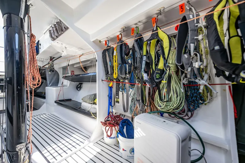 Slide: The Image of Interior of 2007 McConaghy Reichel/Pugh yacht with ropes and gear neatly organized. - 18