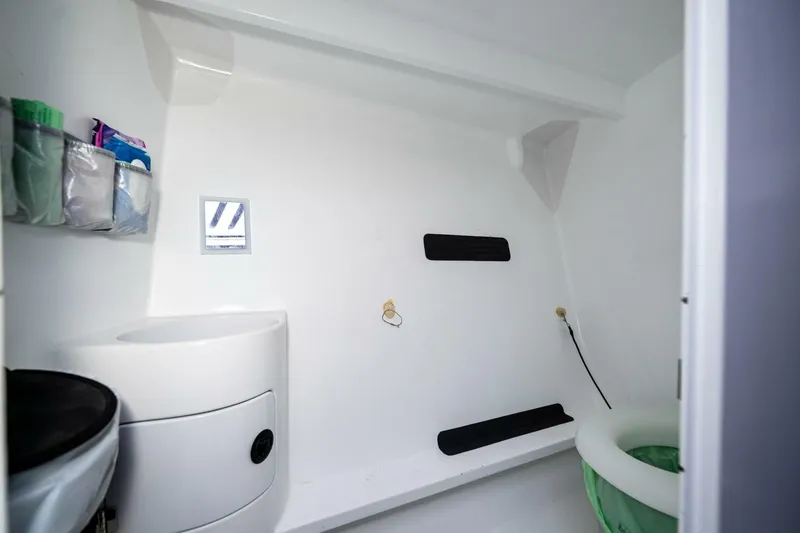Slide: The Image of Interior of 2007 McConaghy Reichel/Pugh yacht, featuring a compact, modern bathroom design. - 20