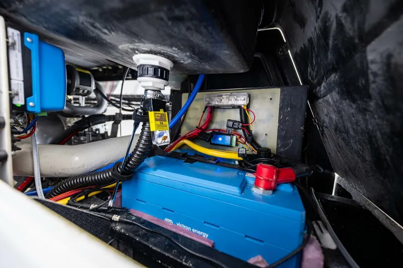 Slide: The Image of Electrical system inside a 2007 McConaghy Reichel/Pugh yacht, featuring wiring and battery components. - 28