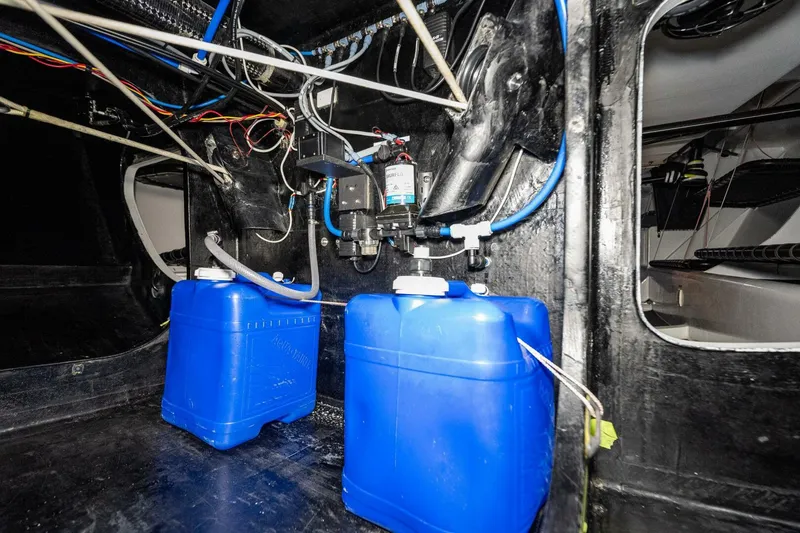 Slide: The Image of Interior of a 2007 McConaghy Reichel/Pugh yacht with blue water tanks and wiring. - 32
