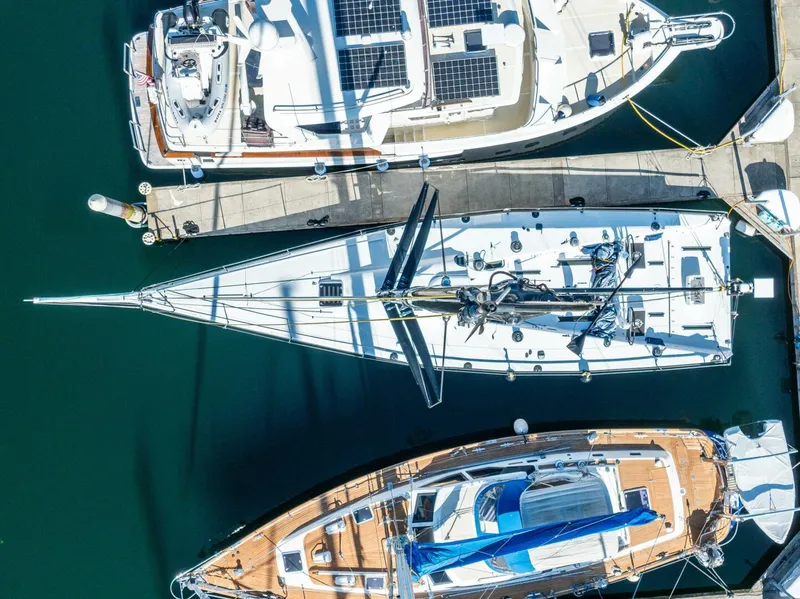 Slide: The Image of Aerial view of 2007 McConaghy Reichel/Pugh yacht docked among other boats. - 4