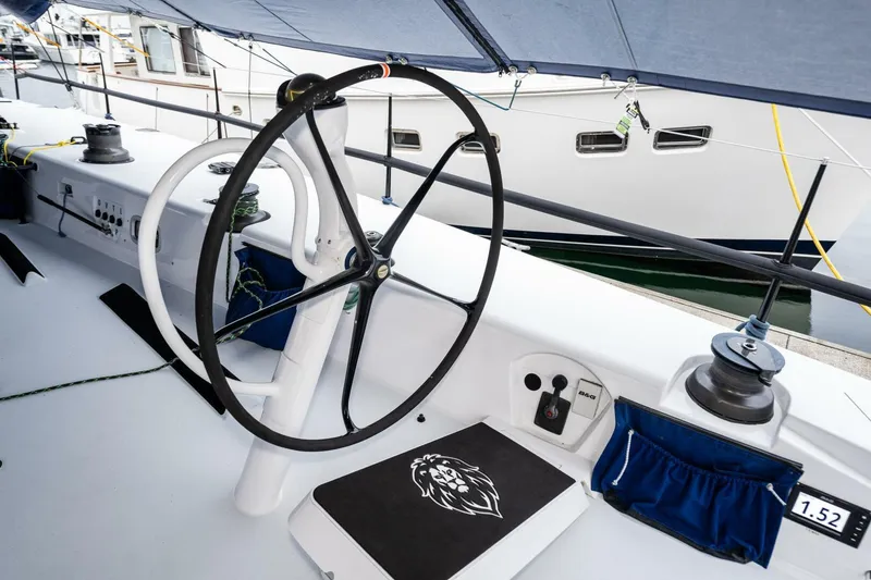 Slide: The Image of Steering wheel of 2007 McConaghy Reichel/Pugh yacht, docked at marina. - 42