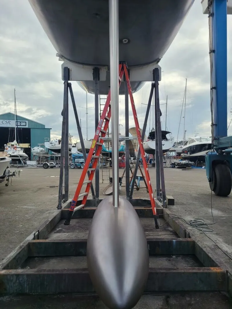 Slide: The Image of 2007 McConaghy Reichel/Pugh yacht in dry dock, showing keel and support structure. - 45