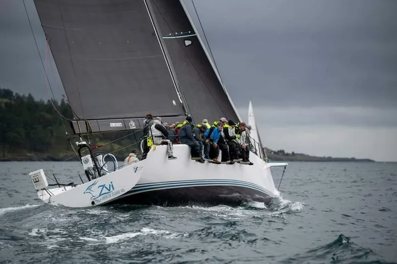 Slide: The Image of Sailing yacht McConaghy Reichel/Pugh 2007 with crew, navigating choppy waters under cloudy skies. - 47