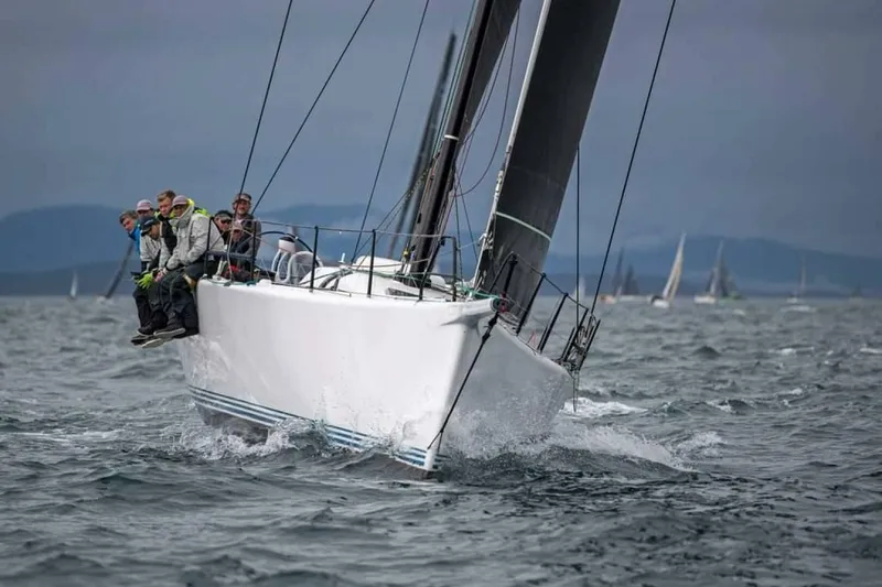 Slide: The Image of Sailing yacht McConaghy Reichel/Pugh 2007 navigating choppy waters with crew on deck. - 48
