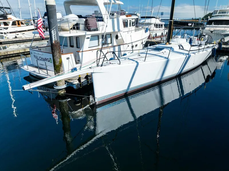 Slide: The Image of 2007 McConaghy Reichel/Pugh yacht docked in a marina, reflecting on calm water. - 5
