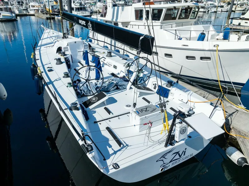Slide: The Image of 2007 McConaghy Reichel/Pugh sailboat docked in a marina, showcasing sleek design and equipment. - 6