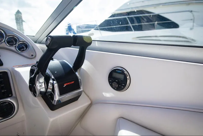 Slide: The Image of Crownline 320 LS 2006 boat interior with Mercury throttle control. - 19