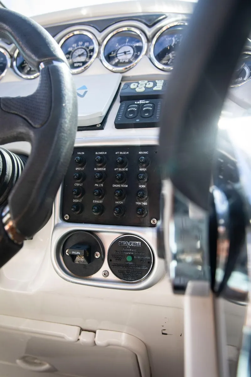 Slide: The Image of Dashboard of 2006 Crownline 320 LS boat with gauges and controls. - 20