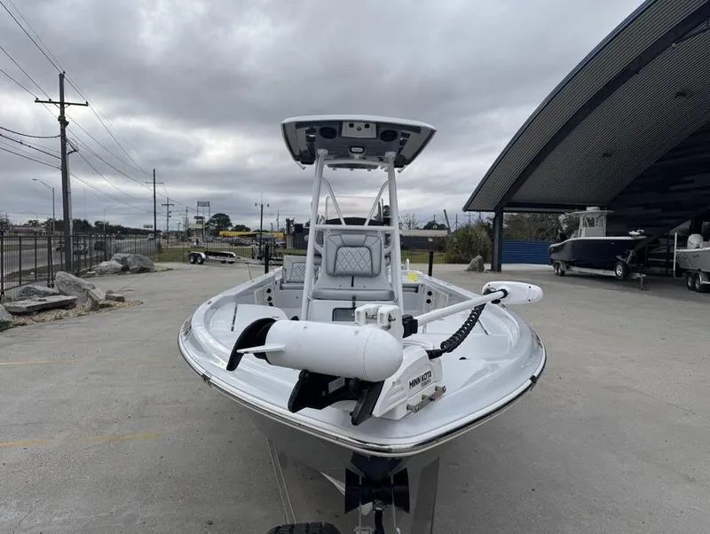 Slide: The Image of 2024 Blue Wave 2400 PURE BAY boat parked outdoors under cloudy sky. - 4