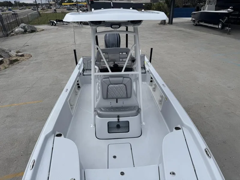 Slide: The Image of 2024 Blue Wave 2400 PURE BAY boat, showcasing spacious deck and seating area. - 8