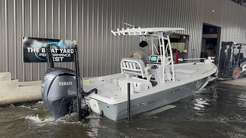 Slide: The Image of 2024 Blue Wave 2400 PURE BAY boat with Yamaha engine at dockside. - 9