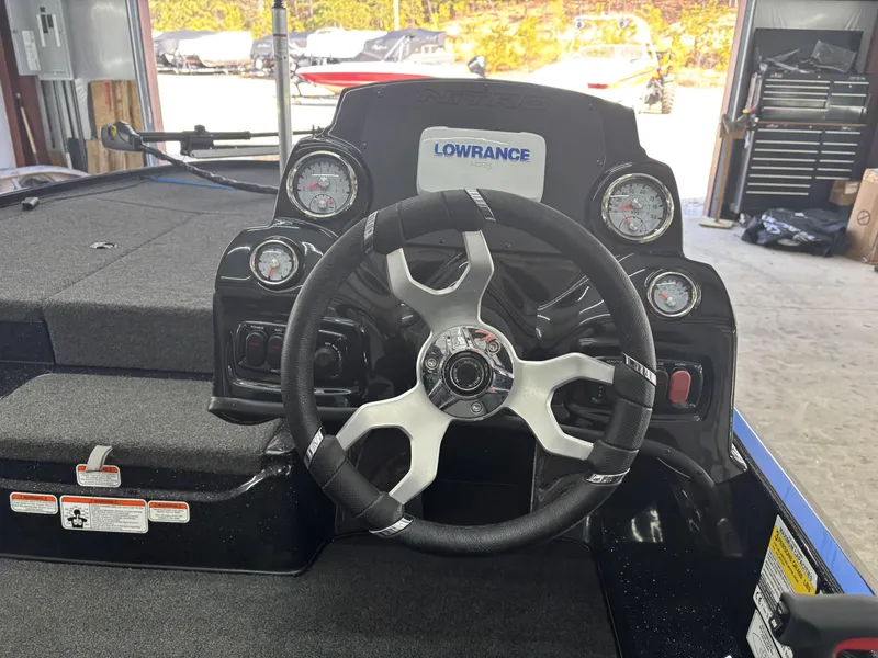Slide: The Image of Steering console of a 2023 Nitro Z17 boat with gauges and Lowrance display. - 12