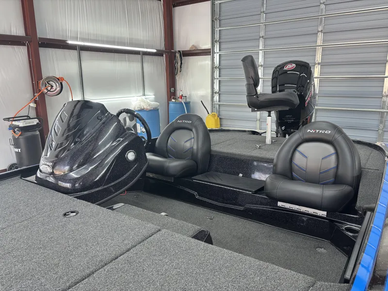 Slide: The Image of 2023 Nitro Z17 boat interior with sleek black seats and modern design. - 17