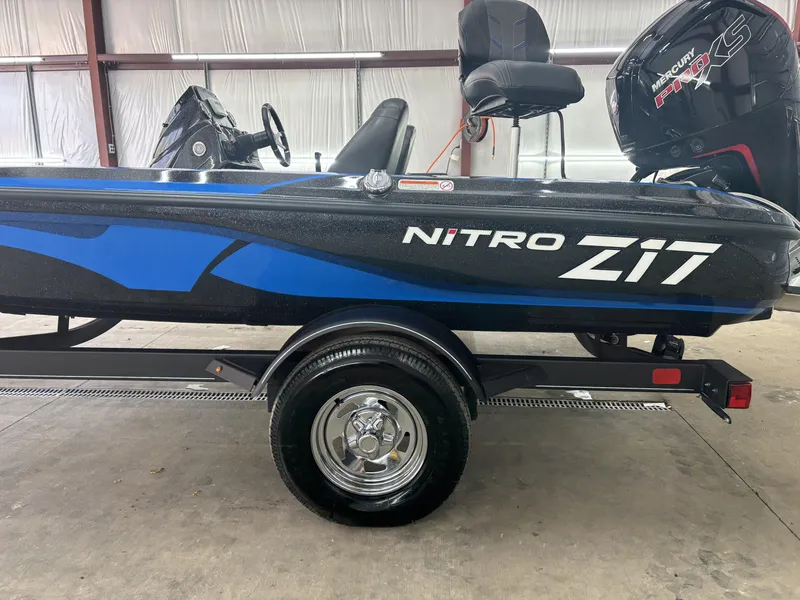 Slide: The Image of 2023 Nitro Z17 boat with Mercury Pro XS engine, displayed indoors on a trailer. - 5