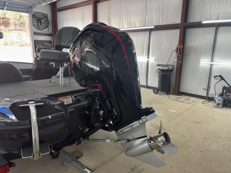Slide: The Image of 2023 Nitro Z17 boat with powerful outboard motor in a garage setting. - 7
