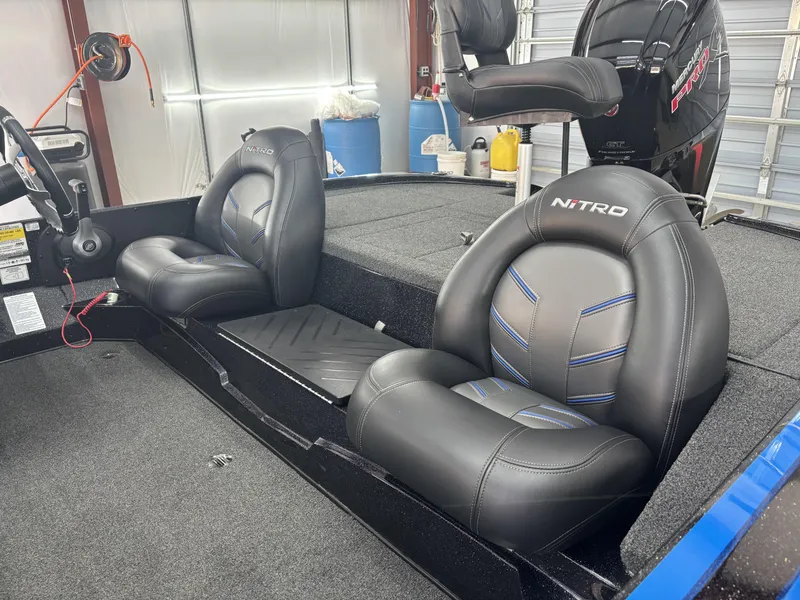 Slide: The Image of 2023 Nitro Z17 boat interior with black leather seats and Mercury engine. - 9
