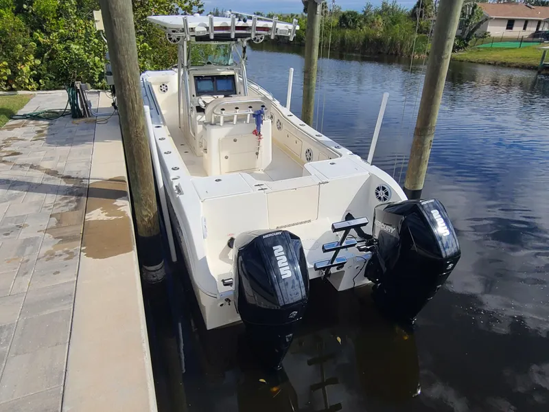 Slide: The Image of 2008 World Cat 270 TE boat docked with dual outboard engines. - 1