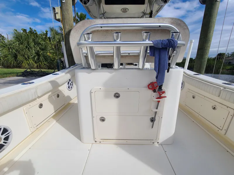 Slide: The Image of 2008 World Cat 270 TE boat interior with rod holders and storage compartments. - 32