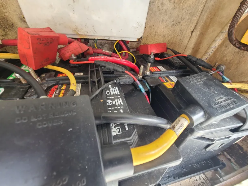 Slide: The Image of Battery compartment of a 2008 World Cat 270 TE boat with visible wiring. - 36