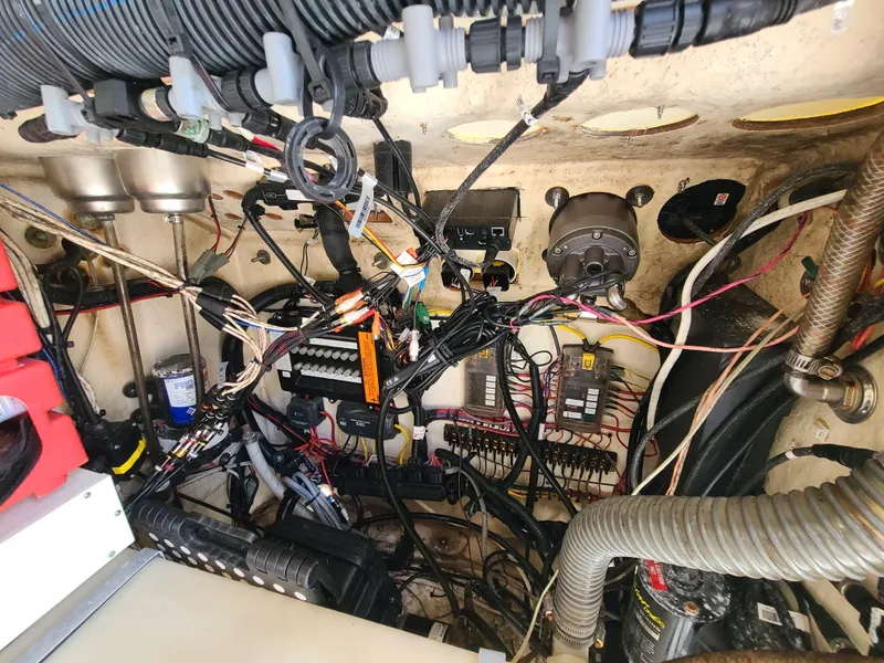 Slide: The Image of Electrical wiring and components inside a 2008 World Cat 270 TE boat. - 47