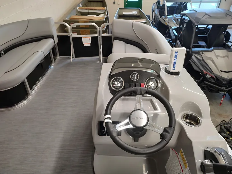 Slide: The Image of 2025 Lowe UC180 boat interior with steering console and seating. - 6