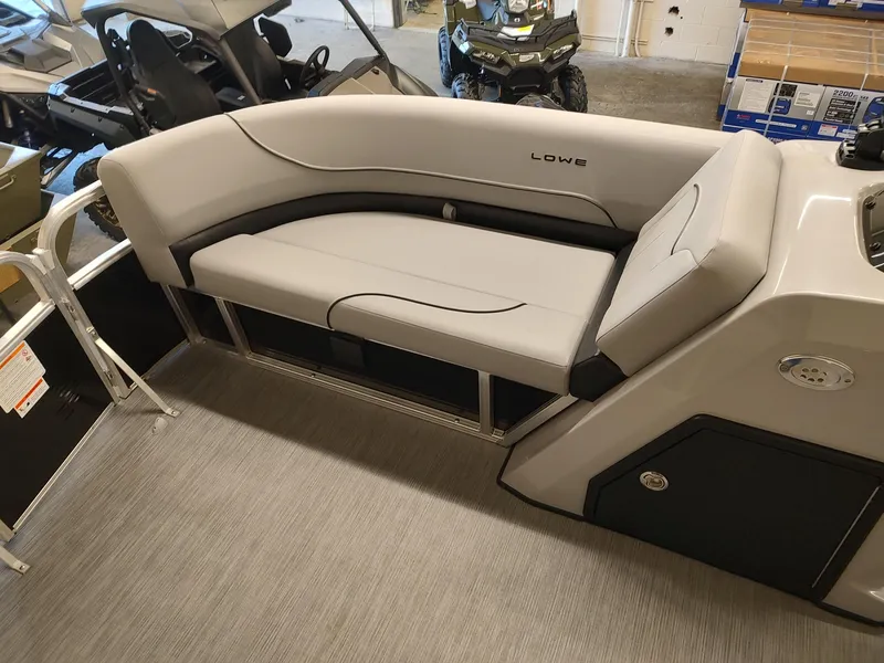 Slide: The Image of 2025 Lowe UC180 boat interior with gray seating and modern design. - 8