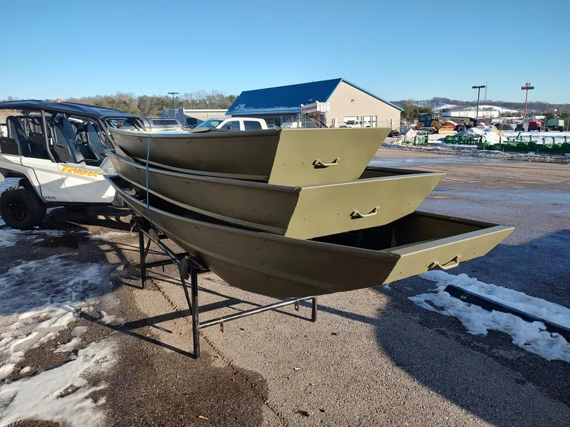 Slide: The Image of Stacked Lowe Jon L1436L boats, 2025 model, on a stand in a snowy outdoor setting. - 3